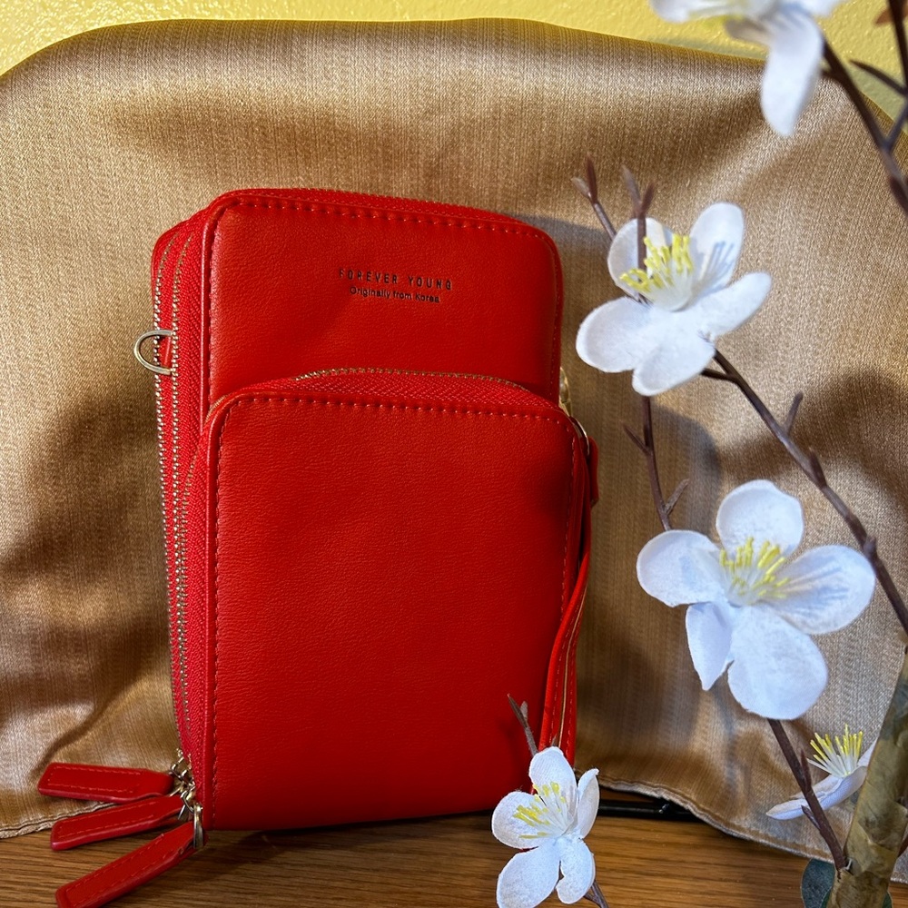 Strawberry red: Forever Young Crossbody/wristlet; 3 compartments.